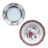 Two famille rose saucer dishes Chinese, 18th Century one with central relief moulded foliate