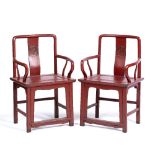 Pair of red lacquer southern official's hat chairs Chinese, Ming style each with a symbol to the