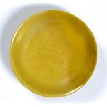Yellow-glazed 'dragon' saucer Chinese, Xuande mark and possibly period incised on the interior