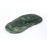 Jadeite boulder New Zealand of irregular oval flattened form with striations 31cm x 14cm approx