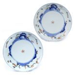 Pair of Kakiemon plates Japanese, 19th Century decorated to the front with a circular plaque with