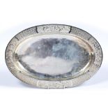 Silver tray Chinese, 19th/20th Century of oval form, the border decorated with stylised flowers,