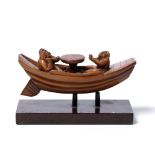 Bamboo carving of three Daoist figures Chinese aboard a boat seated around a circular table