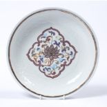 Polychrome saucer dish Chinese, painted with a central Indian lotus in the