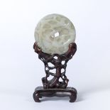 Mutton fat ritual jade bi Chinese, 18th/19th century carved in relief with a dragon encircling the