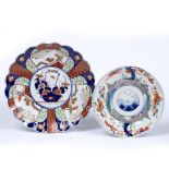 Two Imari plates Japanese, 18th/19th Century the smaller dish having iron red border and