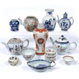 Group of porcelain Chinese,18th/19th Century to include three teapots, a European shape sauce