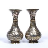 Pair of silver and copper inlaid brass Cairoware vases Syria, 19th/20th Century decorated to the