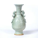 Celadon vase Chinese moulded decoration to the body depicting flowers with two dragon handles 24cm