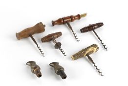 Five corkscrews four with turned wooden handles, one horn example and two bottle stoppers (7)