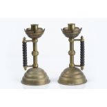 Christopher Dresser for Benham & Froud pair of brass and copper candlesticks, circa 1886, with