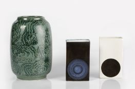 Two Troika pottery slab vases with smooth glaze, the white vase signed Anne Lewis, the black vase