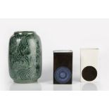Two Troika pottery slab vases with smooth glaze, the white vase signed Anne Lewis, the black vase