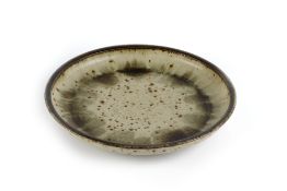 Barbara Cass (1921-1972) shallow dish with speckled glaze, incised signature to the base 38cm across