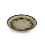 Barbara Cass (1921-1972) shallow dish with speckled glaze, incised signature to the base 38cm across