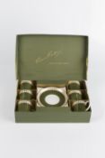Susie Cooper (1902-1995) boxed coffee cups and saucers, green body with gilt leaves (set of six)