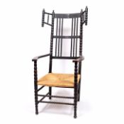 Ernest Gimson (1864-1912) chair, ebonised, bobbin turned uprights, turned finials, and rush seat