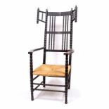 Ernest Gimson (1864-1912) chair, ebonised, bobbin turned uprights, turned finials, and rush seat