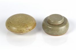 Inkwell and cover celadon glazed, unmarked, 8cm across and one other lidded pot, also unmarked, 10cm