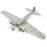 Large model of a Junker plane in riveted metal with three propellers and folding flaps tip to tip is