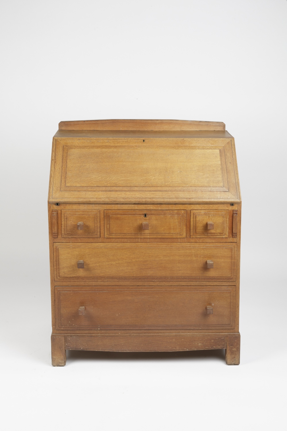 Attributed to Brynmawr bureau, oak, three short and two long drawers 84cm x 107cm x 48cm - Image 2 of 6