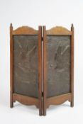 In the manner of Keswick School of Industrial Art fire screen, two copper panels in oak frame