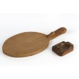 Robert Thompson of Kilburn (1876-1955) Mouseman cheese board, oak, carved mouse signature to