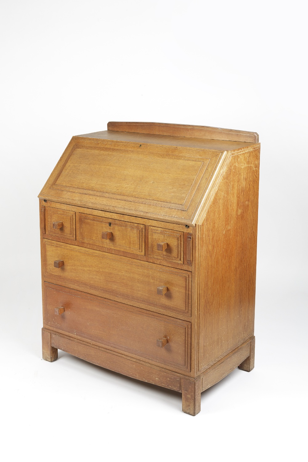 Attributed to Brynmawr bureau, oak, three short and two long drawers 84cm x 107cm x 48cm