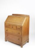 Attributed to Brynmawr bureau, oak, three short and two long drawers 84cm x 107cm x 48cm