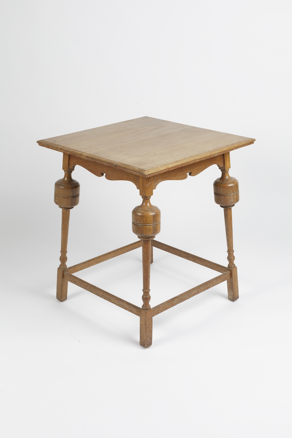 In the manner of Heals square occasional table, the legs with bulbous top, oak 61cm x 71cm