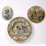 Italian Maiolica dish the centre depicting St Mark at a table, the border depicting cherubs and