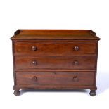 Mahogany estate chest of drawers with raised back rail and turned handles, 113cm across, 55cm