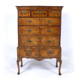 Walnut chest on stand 18th Century, fitted drawers with brass drop handles, 105cm across, 54cm deep,