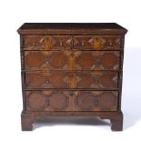 Oak and walnut moulded front chest of drawers late 17th Century, with brass handles and escutcheons,