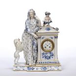 Meissen porcelain cased mantel clock 19th Century, surmounted with a seated putto holding a grape