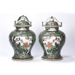 Pair of Chinese famille verte vases decorated to the body with panels depicting birds and foliate