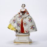 Porcelain model 'Lady of the Mopsorden' Meissen, after J J Kaendler, the figure holding a pug dog on