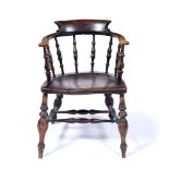Elm and ash smoker's bow armchair 53cm across, 80cm high Provenance: Long Court, Randwick, Glos