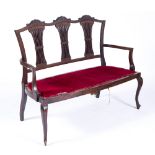 Edwardian mahogany settee with chair back, 122cm across 93cm high Provenance: Long Court,