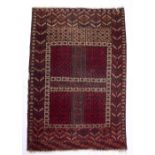 Red ground Turkoman rug with central square panel and geometric designs, 109cm x 155cm