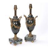 Pair of marble urns French, with applied ormolu mounts to the body, supported by four raised feet,