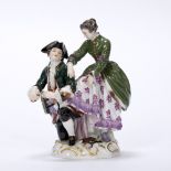 Meissen figure group of ice skaters 19th Century, depicting the gentleman tying a skate onto the