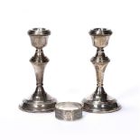 Pair of silver candlesticks with loaded bases, bearing marks for W I Broadway & Co, Birmingham,