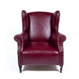 Red leather wingback armchair 72cm across Provenance: Long Court, Randwick, Glos