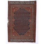 Red ground rug Caucasian, with central shape medallion, 136cm x 85cm approx Provenance: Long