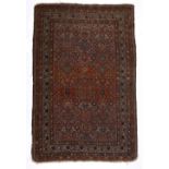 Red ground rug Caucasian, with allover foliate bird and geometric designs within a multiple