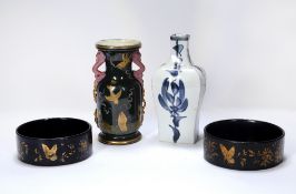 Two late 19th Century bottle coasters black lacquered with gilt decoration, a 20th Century