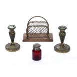 Pair of engraved brass candlesticks early 20th Century, a red glass scent bottle with silver
