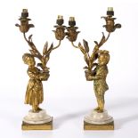 Pair of Louis XVI ormolu and white marble two light candelabra circa 1775, cast as a two figures