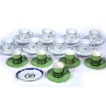 Set of Shelley teacups and saucers with green glaze with silver holders, a set of eight Richard